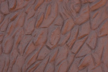brown stone texture from a concrete wall of a building