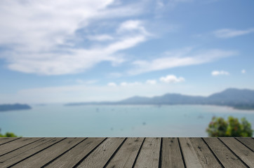 wood table top blur Sea and mountain trees