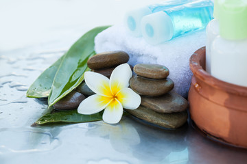 Spa or wellness setting with cream tubes and oil bottles. Body care and spa concept