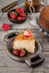 Traditional dessert of Latin America. Three milk cake, tres leches cake on wooden table background.