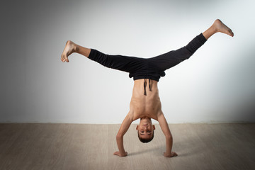 modern style dancer posing on studio background
