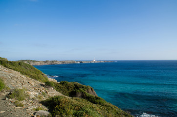 Fototapeta na wymiar Landscape photography of one of the best known places in Menorca on the coast with a lighthouse.