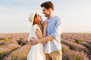 Happy young couple embracing at the lavender field