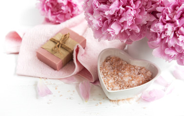 bars of handmade soap,  soft towels and peony flowers