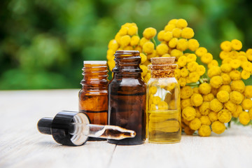 tansy medicinal extract, tincture, decoction, oil, in a small bottle.