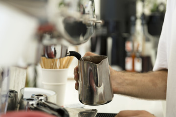 Barista preparing a cup of coffee