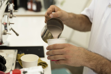 Fototapeta na wymiar Barista preparing a cup of coffee