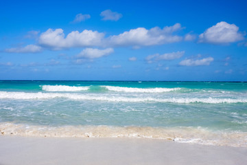 Fototapeta na wymiar White sandy beach and blue sea, concept of tourism and recreation
