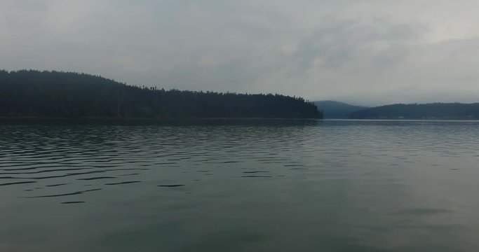 La Conner, WA tourist boat entering Puget Sound on a foggy summer morning
