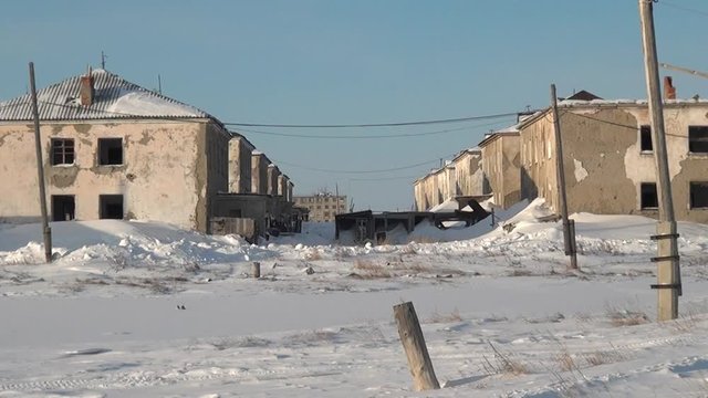 Snow abandoned city Coal Mines on Chukotka of far north of Russia. Way to ghost town Gudym. Unique place for stalkers.
