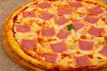 Pizza with ham and pineapple