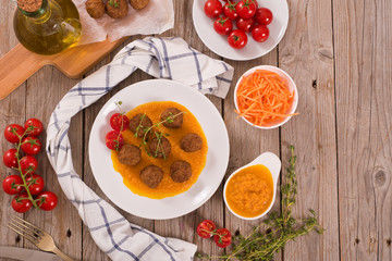 Meatballs with mashed carrots.