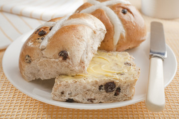Buttered Hot Cross Buns on Yellow Cloth