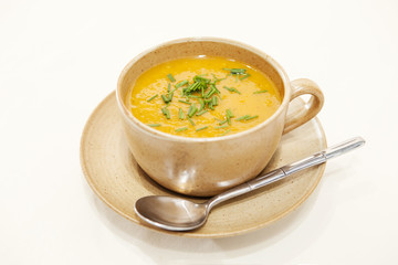 Butternut squash soup in a cup and and saucer