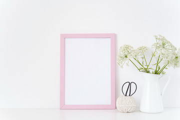 Vintage pink frame mock up with a Aegopodium in jug. Mockup for design. Template for businesses, bloggers, social media. Posterr mockup