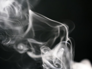 Abstract texture of white smoke isolated on black background