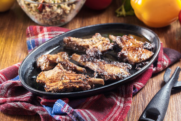 Roasted lamb chops on a roasting dish
