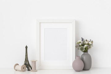 White a5 portrait frame mockup with dried field wild flowers in vases. Background
