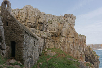 Tiny St Govan's Chapel built on the cliffs of the Pembrokeshire National Park in South Wales