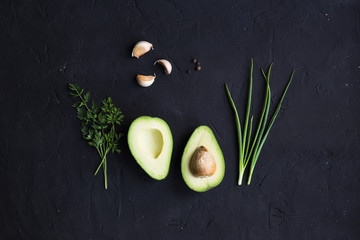 Avocado fruit on a black background