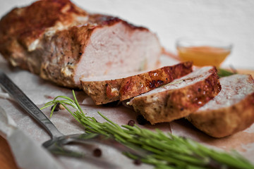 Roasted pork with sauce and rosemary
