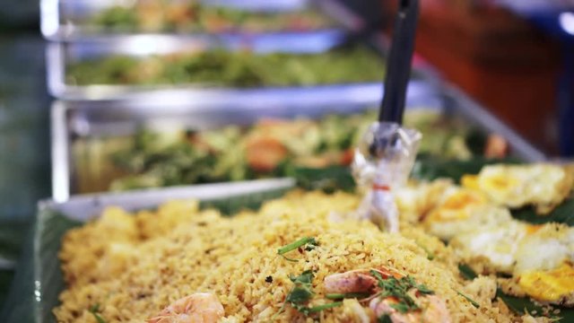 Row of Thai food, fries rices and other food catering in trays