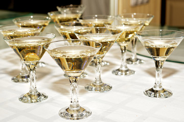 Several glasses of famous cocktail Martini, shot at a bar with shallow depth of field