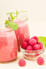 Raspberry smoothie close up photography with fresh summer blended cocktail and ripe berries.
