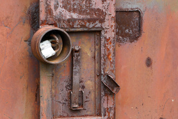Old lock on an old metal container.