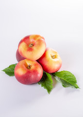 New hybrid sweet fruit nectarina platerina, flat Saturn or donut nectarine peaches close up