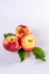 New hybrid sweet fruit nectarina platerina, flat Saturn or donut nectarine peaches close up