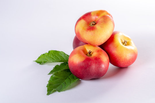 New hybrid sweet fruit nectarina platerina, flat Saturn or donut nectarine peaches close up