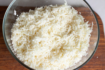 Grated cauliflower in glass bowl
