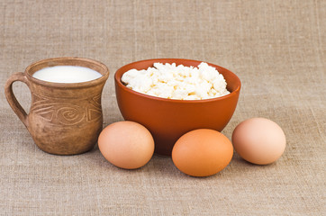 Clay cup of milk, eggs and curds
