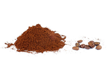 Pile of the ground coffee and few beans isolated on white background