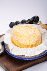 French Langres soft cows crumbly cheese with washed rind structure made in Champagne - Ardenne region