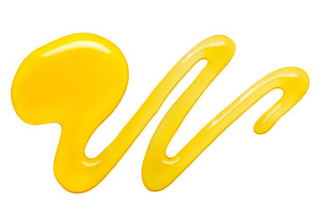 Honey drop  isolated on white background. Pouring sweet honey swirl,  closeup.