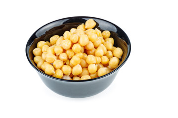 Ceramic bowl full of boiled chickpeas isolated on white background