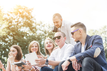 meeting of young people, team of businessmen in nature. Lifestyle, young entrepreneurs