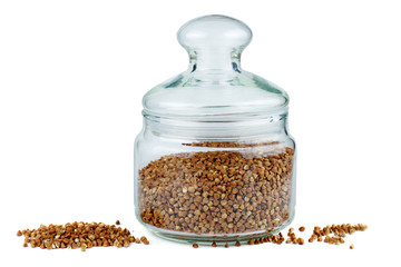 Glass jar with dried buckwheat seeds