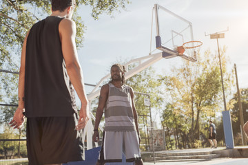 Basketball Players Stretching on the Court