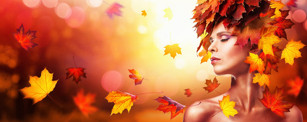 Autumn Beautiful Woman With Falling Leaves Over Nature Background