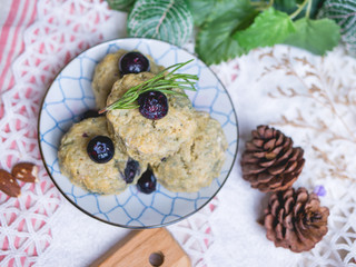 homemade matcha green tea scones set on table.