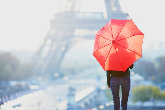 Girl in Paris near the Eiffel tower at morning