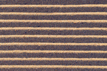 Lines in the sand on the beach, background texture