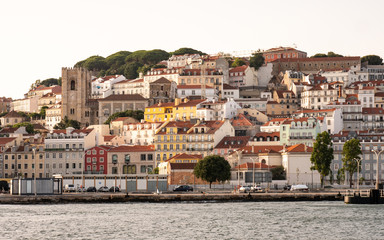 Fototapeta na wymiar Alfama, Lisboa, Portugal. Traditional Lisbon hillside architecture rising from the banks of the Tagus River up through the steep hill streets.
