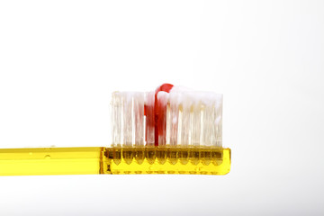 Conceptual image of a toothbrush with fake blood on the bristles