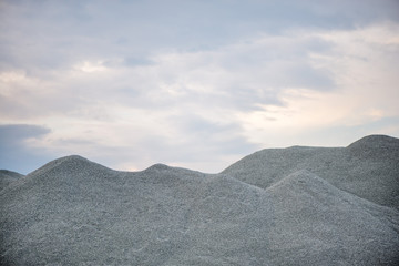 Large piles of construction sand and gravel used for asphalt production and building. Limestone...