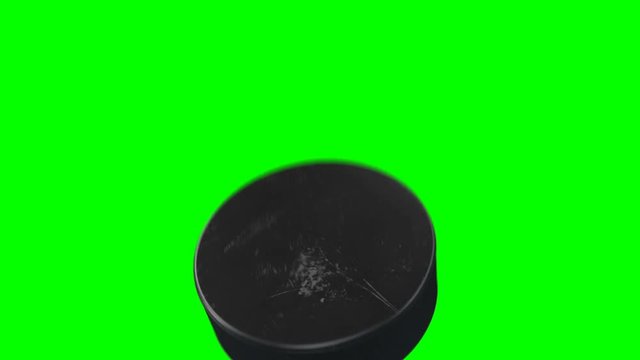 Set of 4 Videos. Beautiful Hockey Puck Hits the Camera in Slow Motion on Green Screen. Hockey 3d Animation of Flying Puck Isolated Alpha Matte. Sport Concept. 4k Ultra HD 3840x2160.
