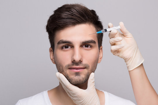 Filler injection for male face in beauty clinic